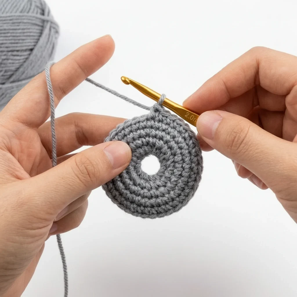 Crocheting the donut keychain base in a ring with a 2mm hook