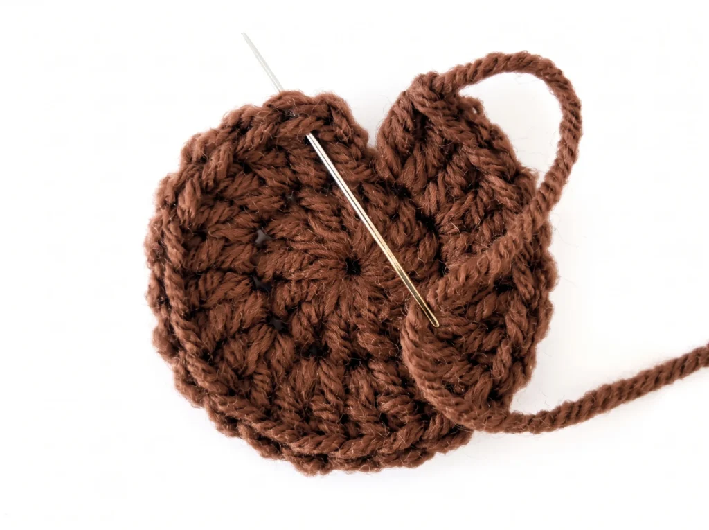 Invisible fasten off in joined rounds step 2 - skipping the first stitch of the round