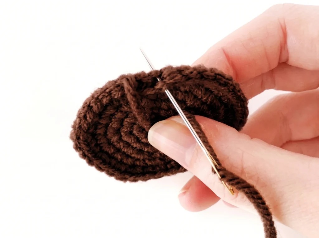 Invisible fasten off step 3 - threading through the back loops to form a false stitch