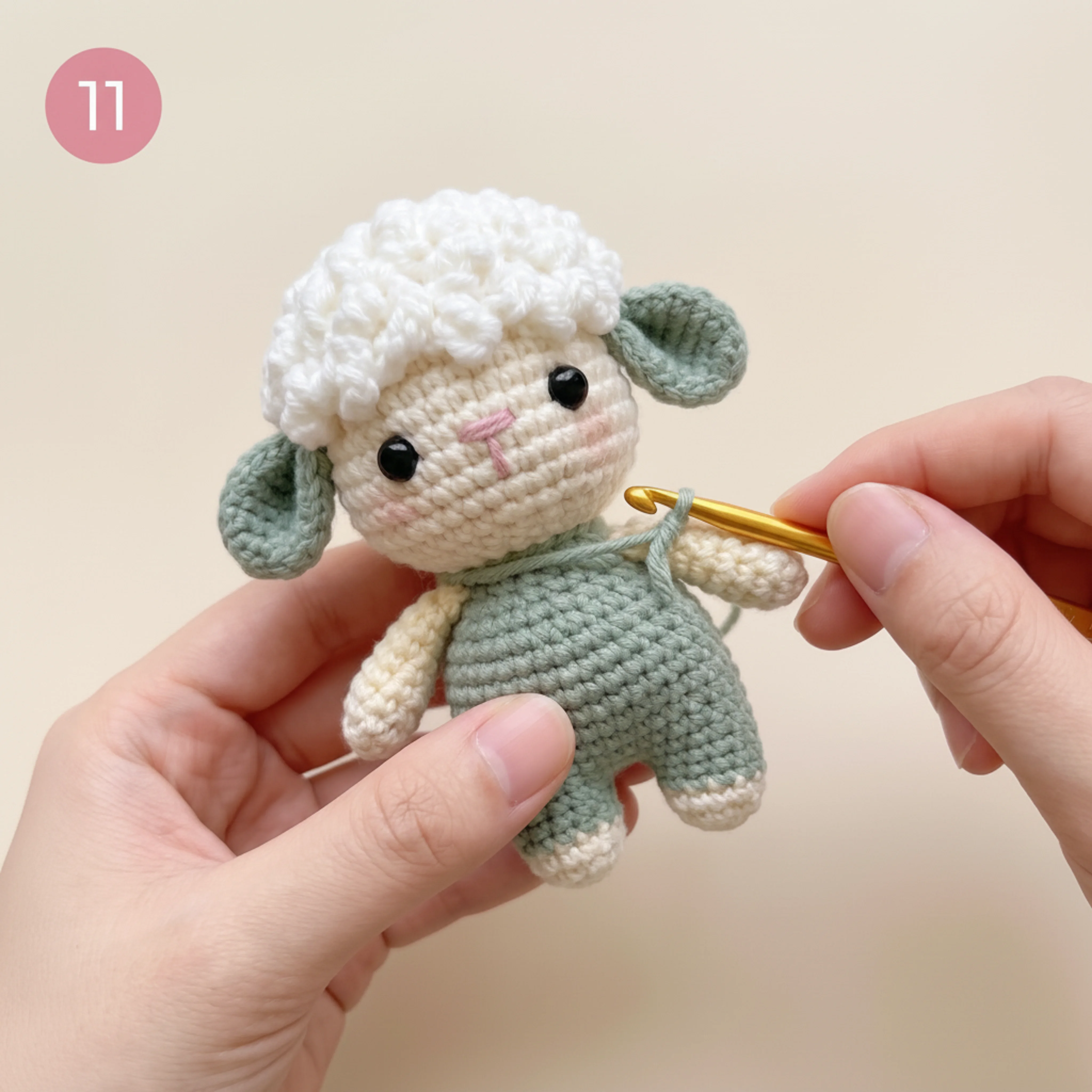 Arms and legs attached to the body of the crochet lamb keychain