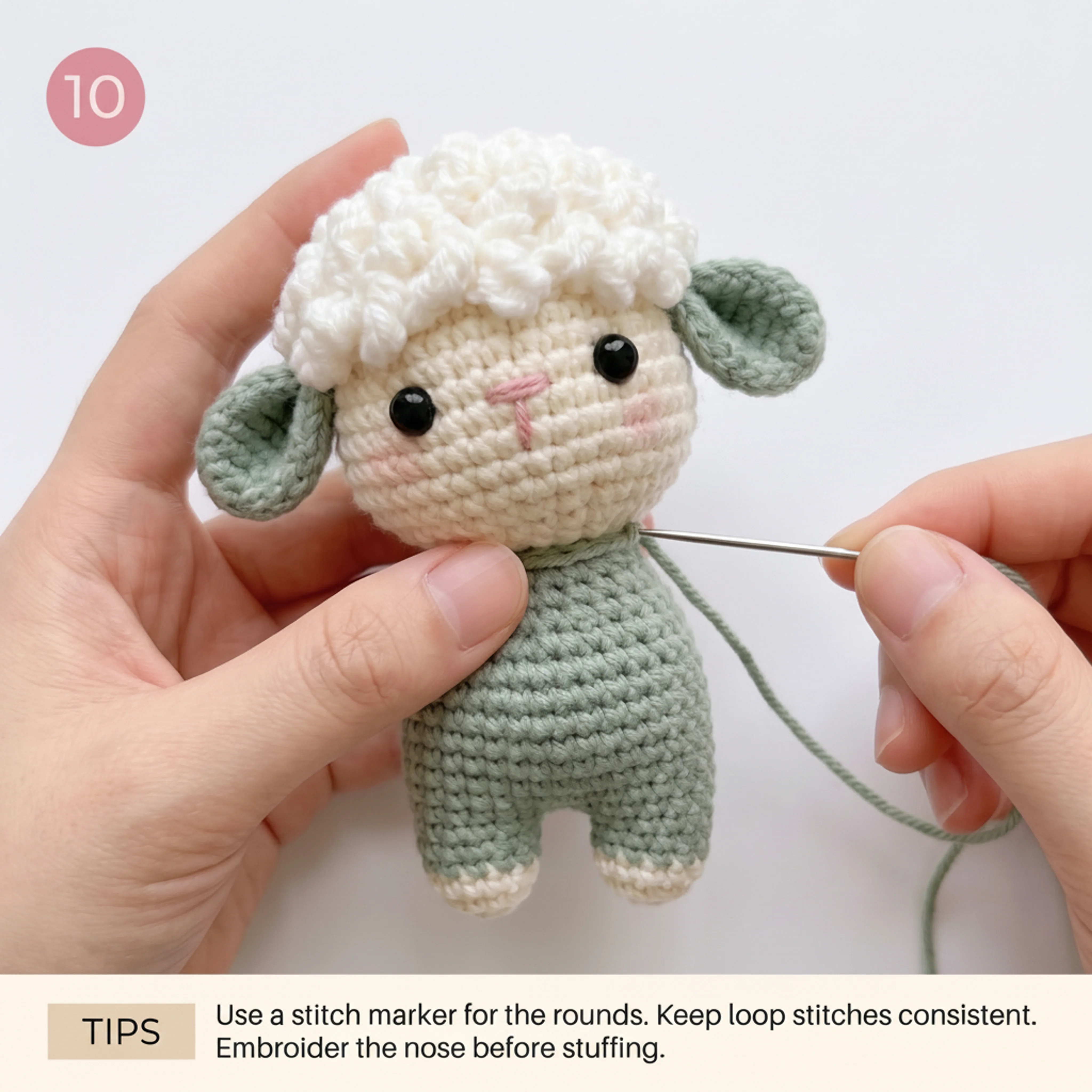Front view of the fully assembled crochet lamb keychain