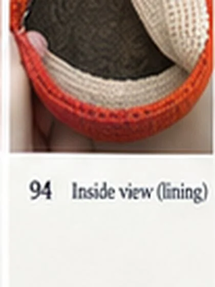 Spiral shell crochet handbag step 94: Insert fitted lining and hand-sew below opening.