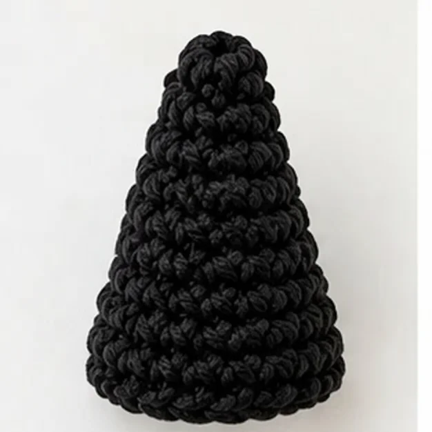 The finished black cone of the crochet witch hat pattern, before the band is attached